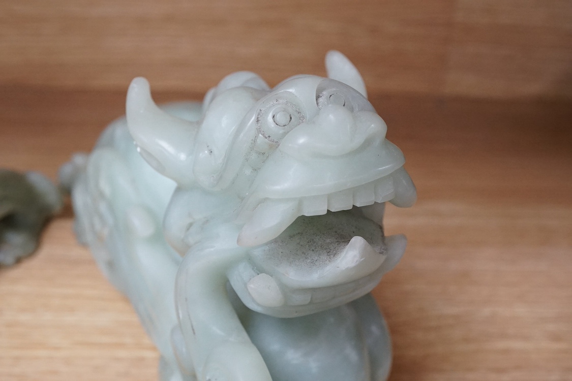 A pair of carved Chinese bowenite jade dragons, 28cm wide. Condition - fair